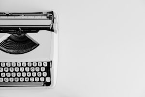 A typewriter on a white background